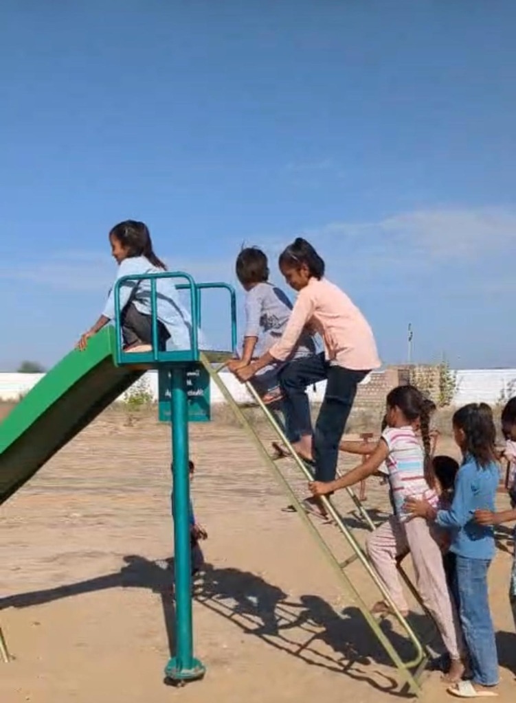 Play for Progress - Children on slide